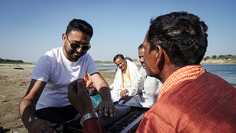 Abhinav Agrawal (left) with one of the folk musicians during his research