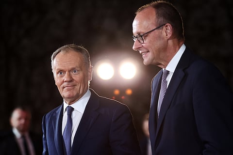 German Chancellor Friedrich Merz welcomes Polish Prime Minister Donald Tusk at the Chancellery in Berlin on Dec. 15, 2025.