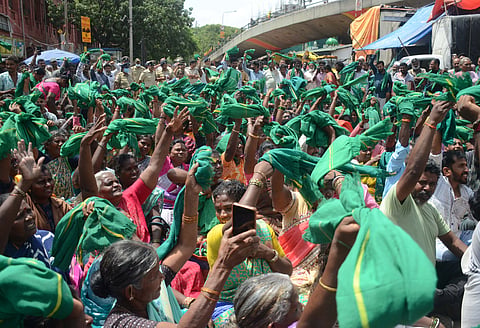 Members of the Karnataka Rajya Raitha Sangha and Green Brigade protest at City Market on Tuesday