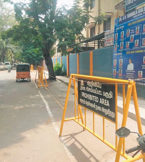 Vehicles parked on the street near the entrance of an aided school were cleared by the police and corporation officials on Wednesday.