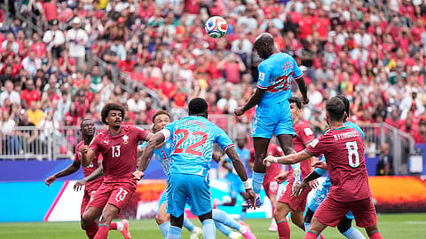Congo's Yoane Wissa, top right, scores his side's first goal during the World Cup Group K football match between Portugal and Congo in Houston, Wednesday, June 17, 2026.