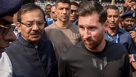 Ex-Bengal Minister Aroop Biswas with Lionel Messi at Salt Lake Stadium last year.