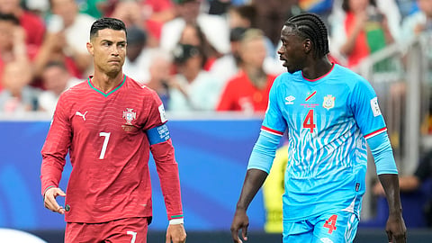 Portugal's Cristiano Ronaldo, left, and Congo's Axel Tuanzebe react during the World Cup.