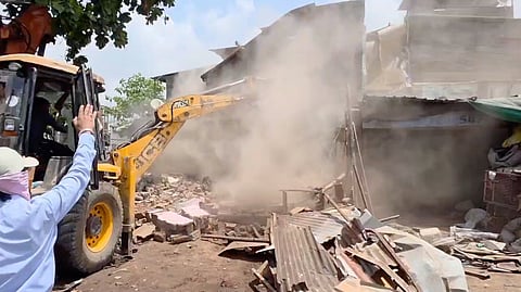 Civic body officials demolished a rooftop structure in Katargam and seized the material.