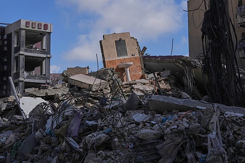 A bathroom mirror and sink remain standing amid the rubble of buildings damaged by Israeli strikes near the Jabal Amel Hospital in the southern port city of Tyre, Lebanon, Thursday, June 18, 2026.