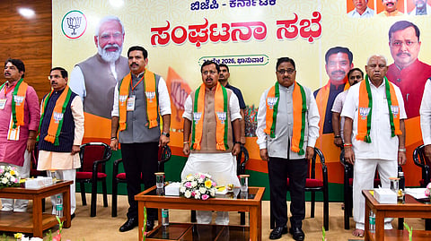 In this photo from May 24, 2026, BJP National President Nitin Nabin, along with former Karnataka Chief Minister BS Yediyurappa, BJP Karnataka President BY Vijayendra, and others, stand during the party meeting at the BJP office in Bengaluru.
