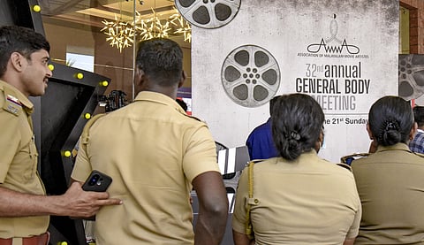 Police personnel stand guard at the Annual General Meeting of the Association of Malayalam Movie Artists (AMMA), in Kochi