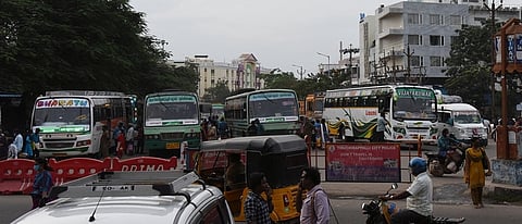 Vehicles crawl through traffic outside the Chathiram Bus Stand in Tiruchy. Authorities have launched a series of measures, including rerouting Cuddalore-bound buses from Panjappur, to decongest the busy transit hub.