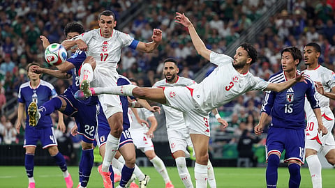 Japan's Takehiro Tomiyasu (22), Tunisia's Ellyes Skhiri (17) and Tunisia's Montassar Talbi (3) battle for the ball during the World Cup Group F soccer match between Tunisia and Japan in Guadalupe, near Monterrey, Mexico, Saturday, June 20, 2026.