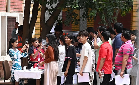 Medical aspirants entering an exam centre to appear for NEET in New Delhi.