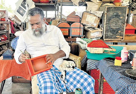 V V Suresh Kumar working on a traditional Nettur petti at his workshop in Thiruvananthapuram