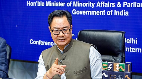 Union Minister Kiren Rijiju speaks during a meeting in New Delhi.