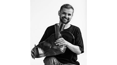Artist Murari Jha with his sculpture