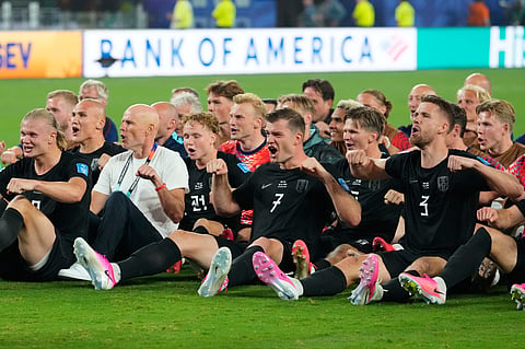 Erling Haaland (extreme L) does the 'Viking Row' celebration with his teammates