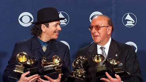 Carlos Santana, left, and producer Clive Davis pose with their Grammys at the 42nd Grammy Awards in Los Angeles, on Feb 23, 2000.
