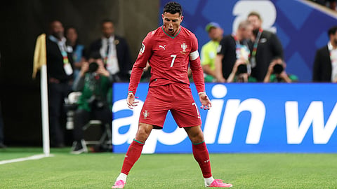 Portugal's Cristiano Ronaldo celebrates scoring his team's first goal during the FIFA World Cup 2026 Group K match against Uzbekistan at Houston Stadium in Houston, Texas on Tuesday