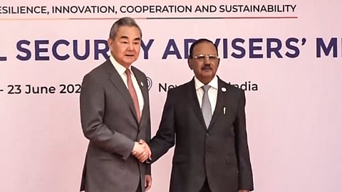 National Security Adviser Ajit Doval welcomes China's Foreign Affairs Minister Wang Yi at the BRICS National Security Advisers' meeting, in New Delhi, Tuesday, June 23, 2026.