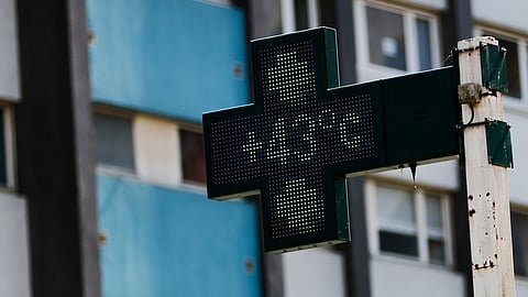 A drugstore sign shows the temperature 43 degrees Celsius (109,4 degrees Fahrenheit) in Rennes, western France, Monday, June 22, 2026.