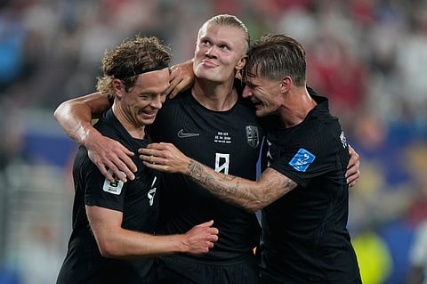Norway's Erling Haaland (9) celebrates Norway's Patrick Berg, left, and David Moeller Wolfe, right after scoring their third goal during the World Cup Group I soccer match between Norway and Senegal in East Rutherford, N.J., near New York, Monday, June 22, 2026.
