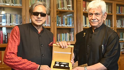 Congress MP Shashi Tharoor with L-G Manoj Sinha in Srinagar on Sunday.
