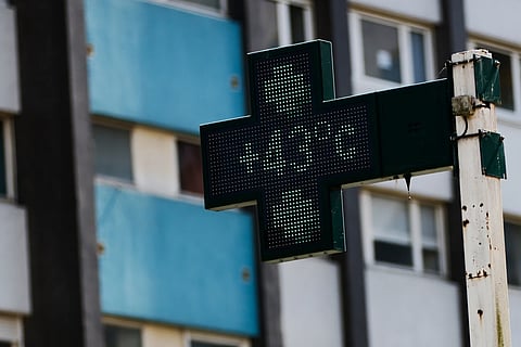 A drugstore sign shows the temperature 43 degrees Celsius (109,4 degrees Fahrenheit) in Rennes, western France, Monday, June 22, 2026.