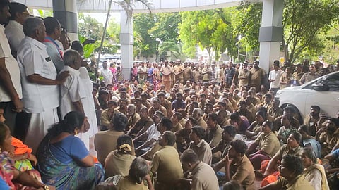 More than 500 sanitation workers boycotted their work and staged a sit-in protest on Monday, urging the Erode Corporation to abandon plans to privatize solid waste management operations.