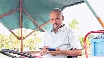 Video grab of the driver and the tractor carrying garbage at the Yele Mallappashetty Lake buffer zone.