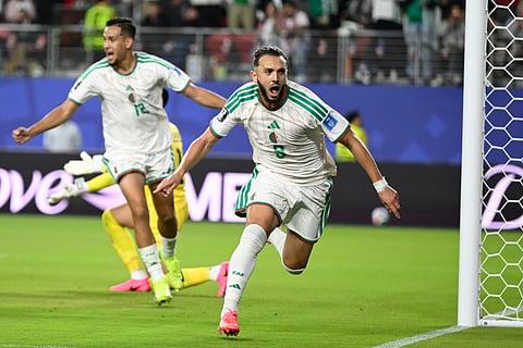 Algeria's Amine Gouiri, front, celebrates after scoring his side's second goal against Jordan during the World Cup Group J soccer match in Santa Clara, Calif., near San Francisco, Monday, June 22, 2026.