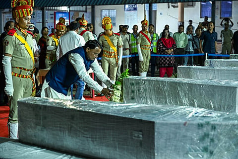 Odisha CM Mohan Majhi pays his obeisance to mortal remains of victims who died in an ammonia gas leak at sea food processing unit in Tamil Nadu