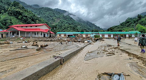 Debris scattered across an area after a landslide and flash floods near the NEEPCO project colony, Keyi Panyor district, Arunachal Pradesh, Wednesday, June 24, 2026.