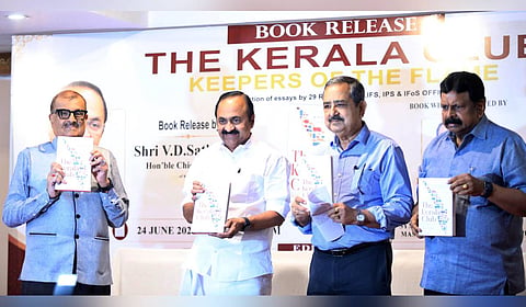Chief Minister VD Satheesan releases the book 'The Kerala Club: Keepers of the Flame'. Ashok Lahiri, vice-chairman of NITI Aayog, former cabinet secretary K M Chandrasekhar and Trivandrum Chamber of Commerce president S N Raghuchandran Nair are also seen.