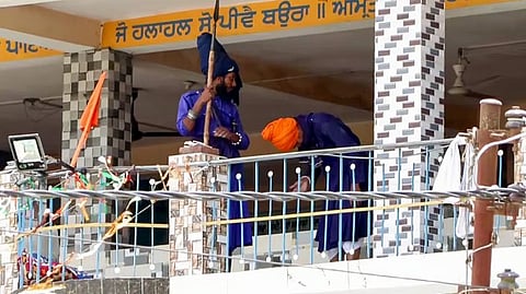 A group of Nihang Sikhs arrive at the Gurdwara at Nagrasu in Rudraprayag to persuade the Nihangs staying inside to comply, Tuesday, May 23, 2026.