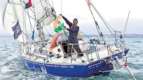 Cdr Abhilash Tomy (retd) waves the Tricolour after finishing second in the Golden Globe Race 2022.