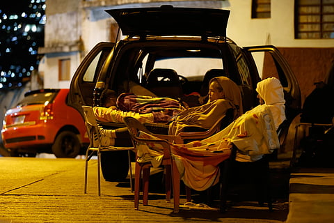 People sleep outside their homes following an earthquake in Caracas, Venezuela, Thursday, June 25, 2026