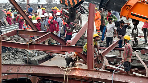 Army and National Disaster Response Force (NDRF) personnel carry out a rescue operation at the site of an under-construction godown collapse at Taratala, in Kolkata district, Wednesday, June 24, 2026.