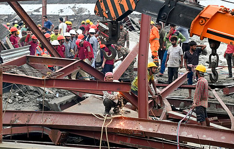 Army and National Disaster Response Force (NDRF) personnel carry out a rescue operation at the site of an under-construction godown collapse, at Taratala, in Kolkata district, Wednesday, June 24, 2026.