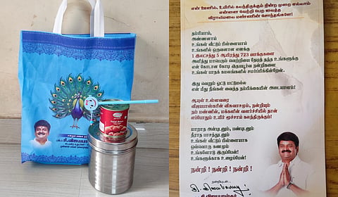 The gift hamper, worth around Rs 300, contains a stainless steel container, a tin of gulab jamun, a pen, and a printed note thanking voters for the 1,05,723 votes Vijayabaskar received in the recent Assembly election.