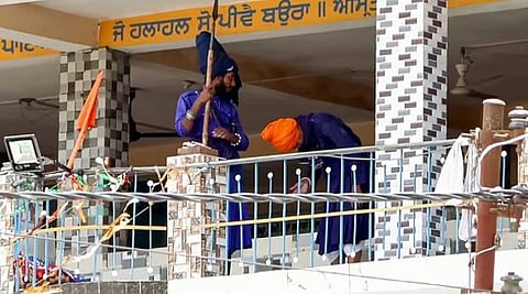 A group of Nihang Sikhs arrive at the Gurdwara at Nagrasu in Rudraprayag to persuade the Nihangs staying inside to comply, Tuesday, May 23, 2026.