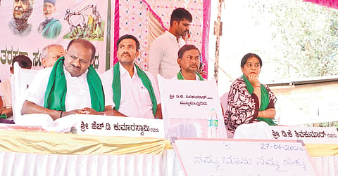 Union Minister HD Kumaraswamy lends his support to farmers protesting against the proposed Bidadi Township project in Byramangala on Saturday. He sat next to an empty chair, taking a dig at CM DK Shivakumar for not being present at the venue