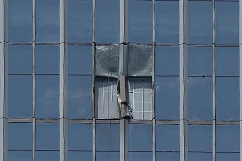 A section damaged after a small plane crashed into it is boarded up at the CITIC Tower, also known as China Zun, the tallest building in Beijing, on Saturday, June 27, 2026.