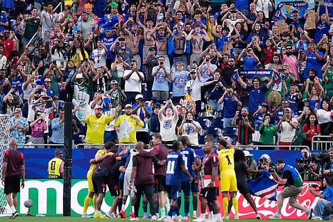 Cape Verde players celebrate in front of their fans