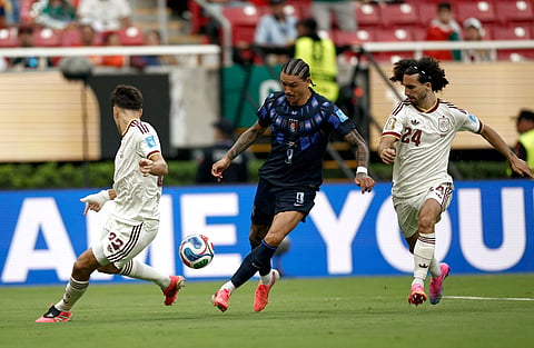 Spain defenders vie for the ball against Uruguay's Darwin Nunez on Friday
