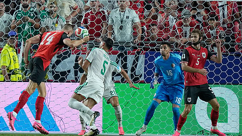 Austria's Sasa Kalajdzic (14) shoots and scores team's third goal past Algeria goalkeeper Oussama Benbot (16) during the World Cup Group J soccer match between Algeria and Austria in Kansas City, Mo., Saturday, June 27, 2026.