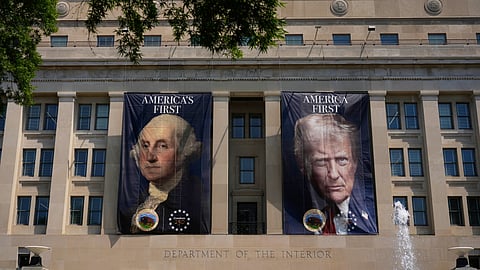Banners, one of US President George Washington that reads "America's First", left, and another of President Donald Trump that reads "America First", are pictured at the Department of the Interior, Thursday, June 25, 2026, in Washington.