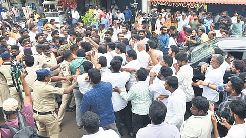 Police control YSRCP and TDP workers at Undavalli as members of the Opposition party set out to visit Penumaka farmers on Saturday.