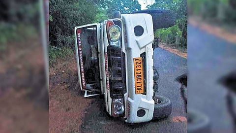 Overturned forest department vehicle.