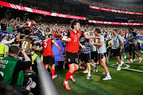 Austria players celebrate Sasa Kalajdzic's late goal against Algeria on Saturday