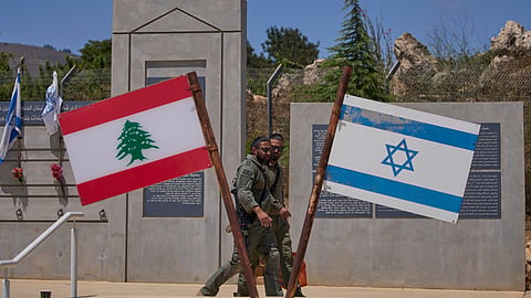 Israeli soldiers are seen at a memorial site on the border with Lebanon in northern Israel, Sunday, June 28, 2026.
