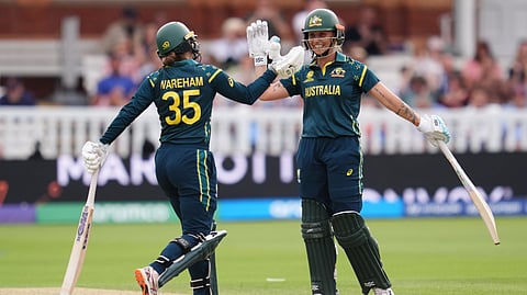 Australia's Georgia Wareham and Ashleigh Gardner celebrate the winning runs as they beat India during the Women's T20 World Cup cricket match between Bangladesh and South Africa at Lord's Cricket Ground, in London, Sunday June 28, 2026.