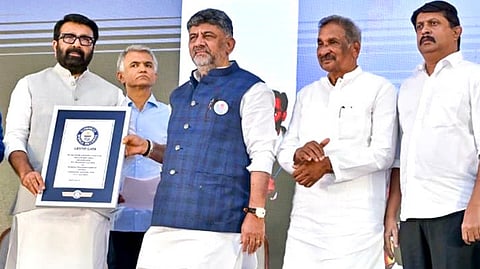 Chief Minister DK Shivakumar and BDA Chairman NA Haris show the Guinness World Record certificate received on Sunday.